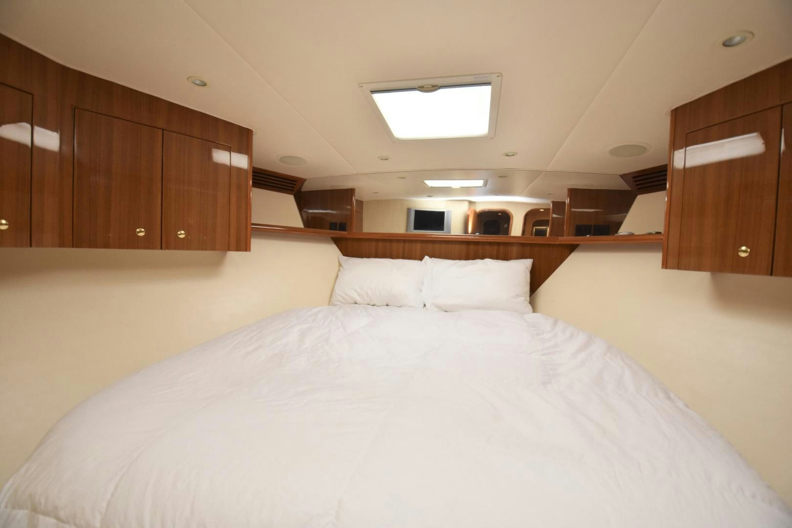 a bed with white sheets aboard Hoof Hearted Yacht for Sale