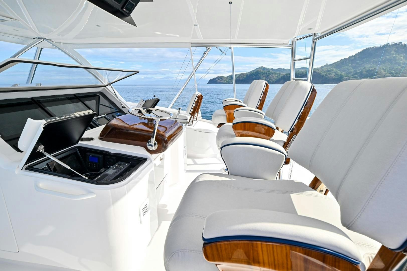 a boat with a table and chairs on it aboard EL LOBO Yacht for Sale