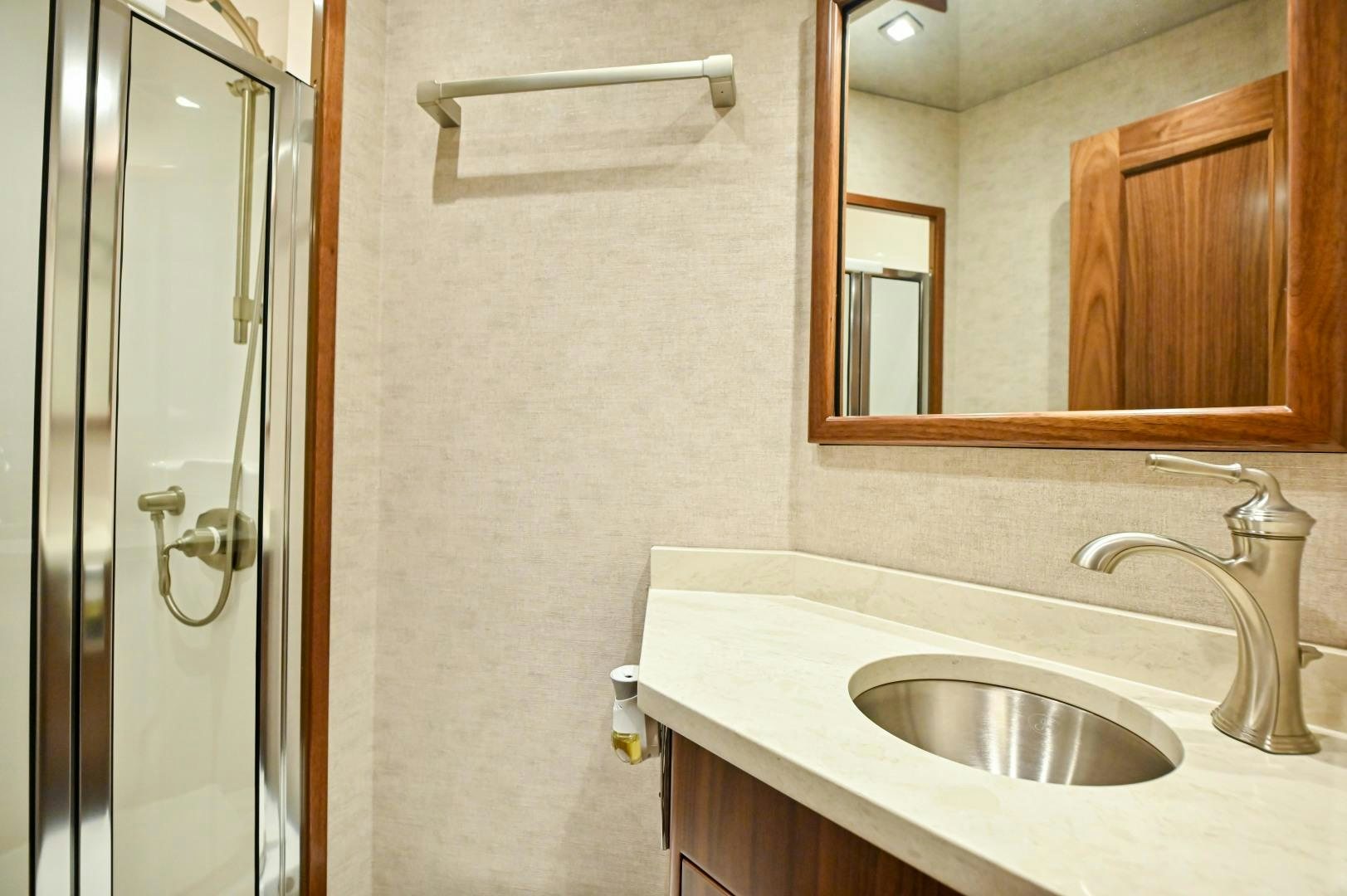 a bathroom with a sink and a mirror aboard EL LOBO Yacht for Sale