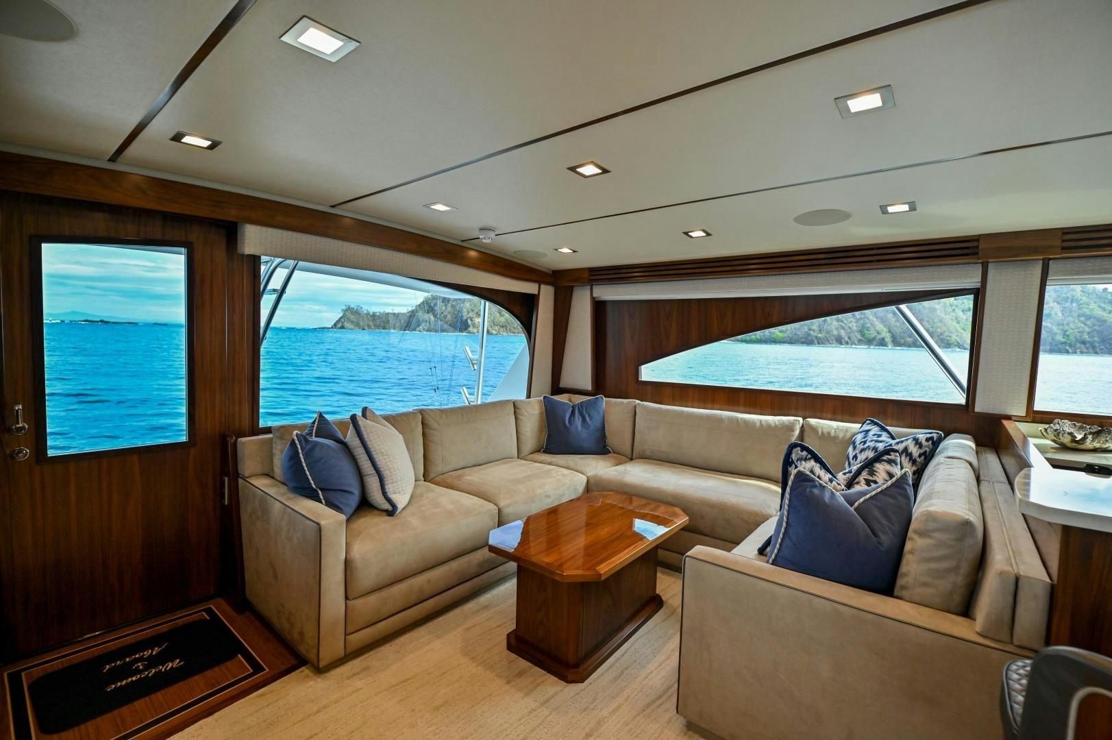 a living room with a couch and a table aboard EL LOBO Yacht for Sale