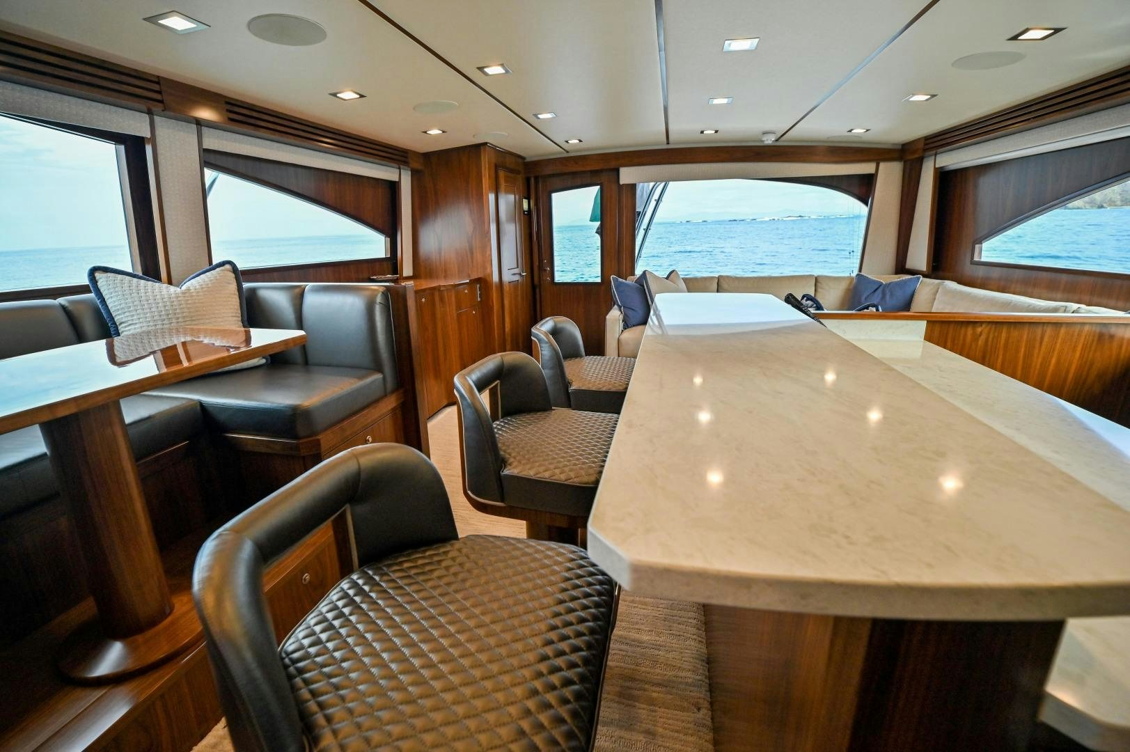 a room with a table and chairs aboard EL LOBO Yacht for Sale