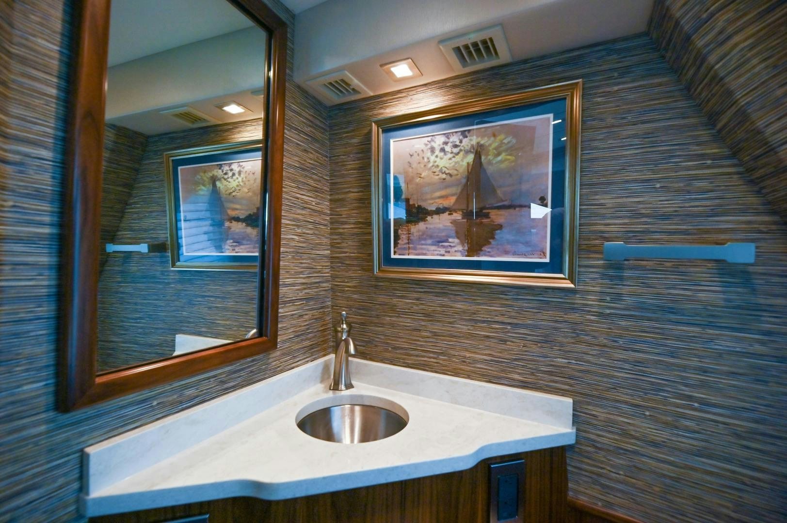 a bathroom with a sink and a mirror aboard EL LOBO Yacht for Sale