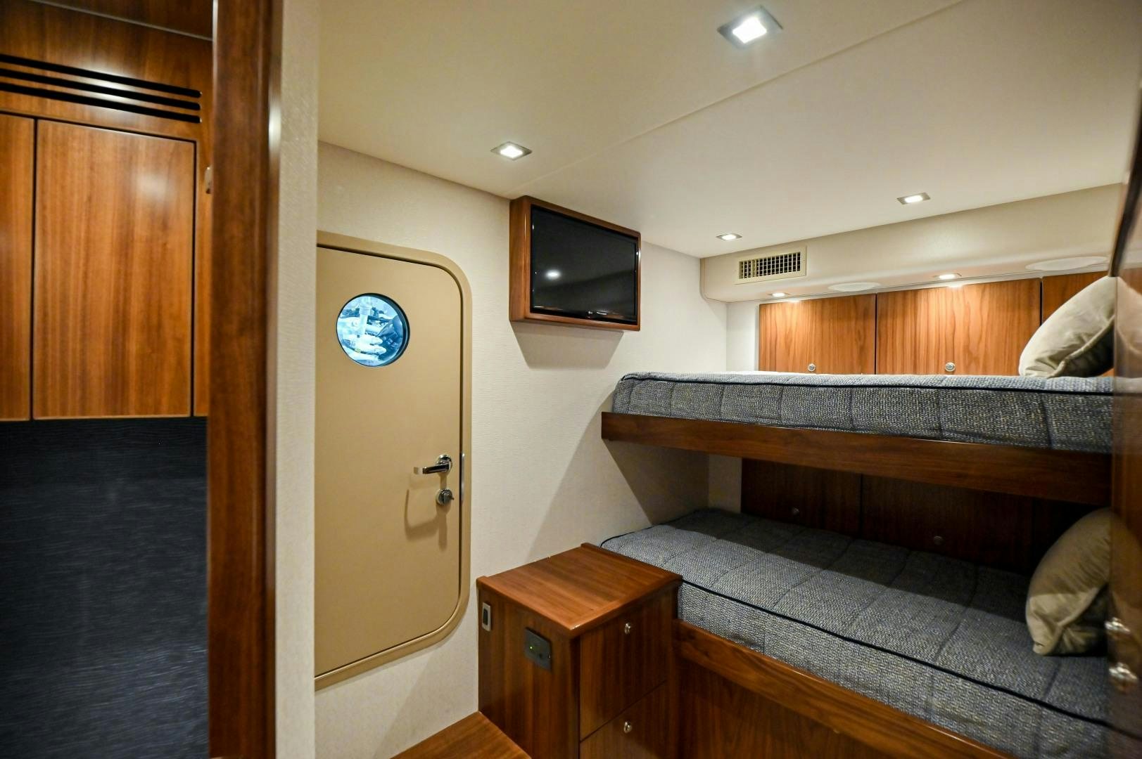 a room with a bed and tv aboard EL LOBO Yacht for Sale