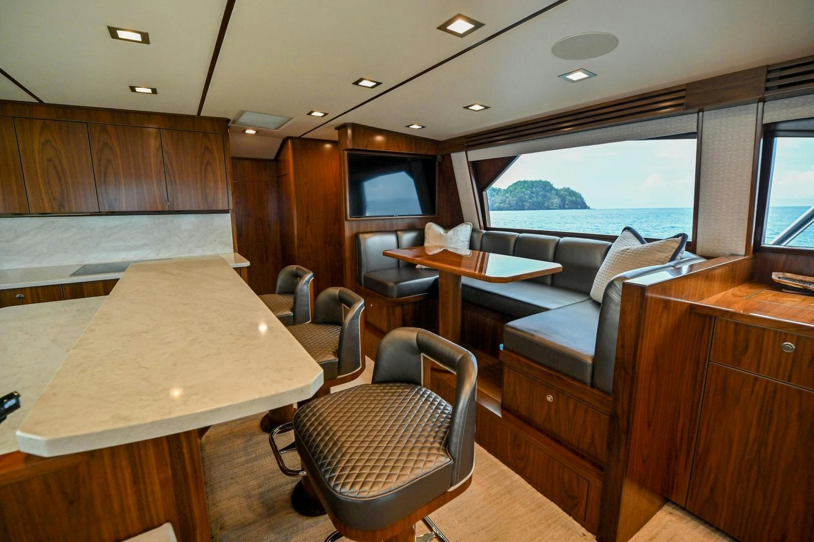 a room with a table and chairs aboard EL LOBO Yacht for Sale