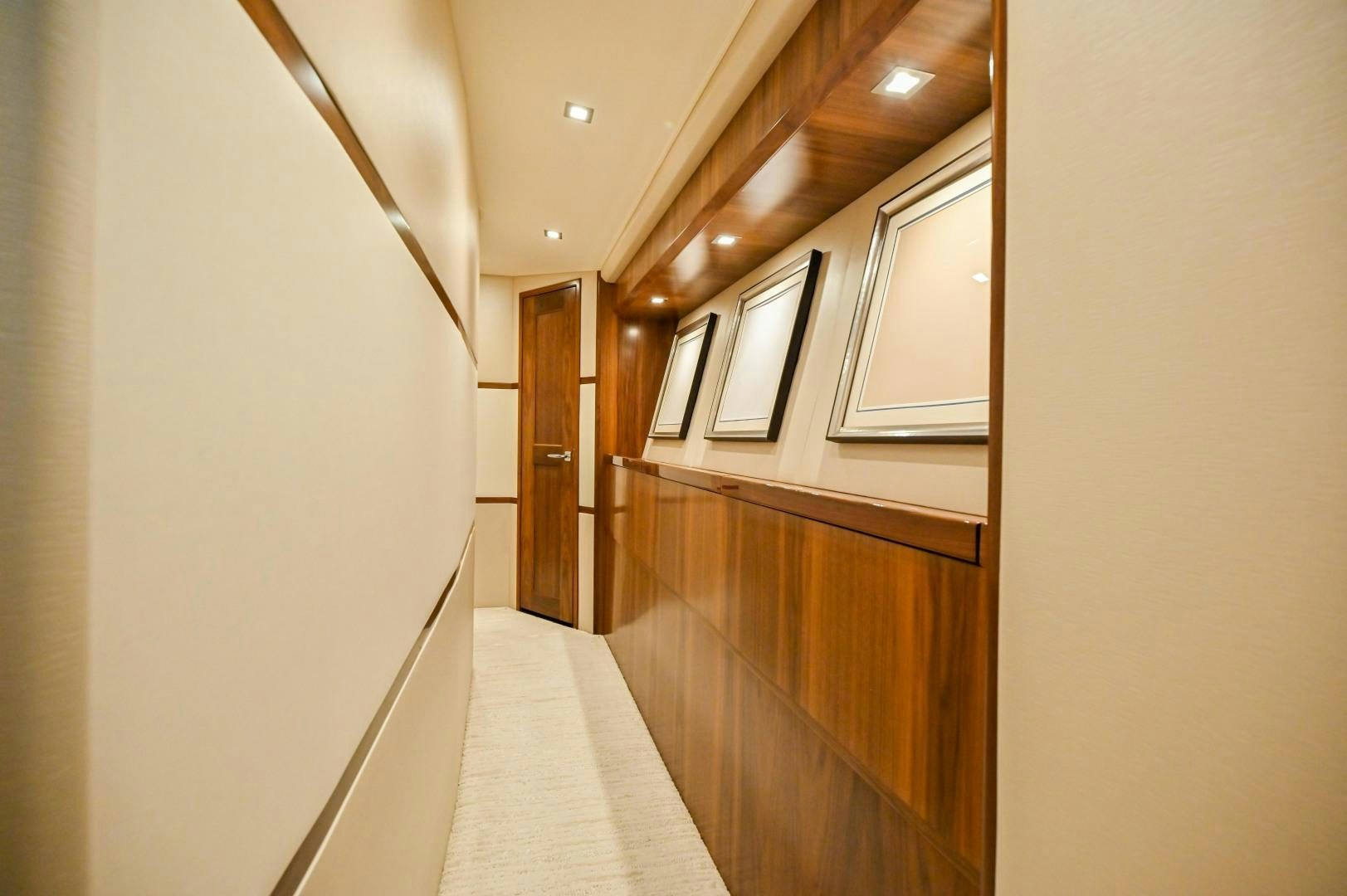 a hallway with wooden cabinets aboard EL LOBO Yacht for Sale