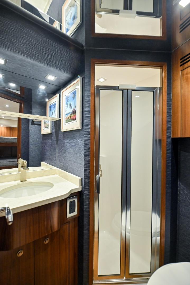 a bathroom with a glass door aboard EL LOBO Yacht for Sale