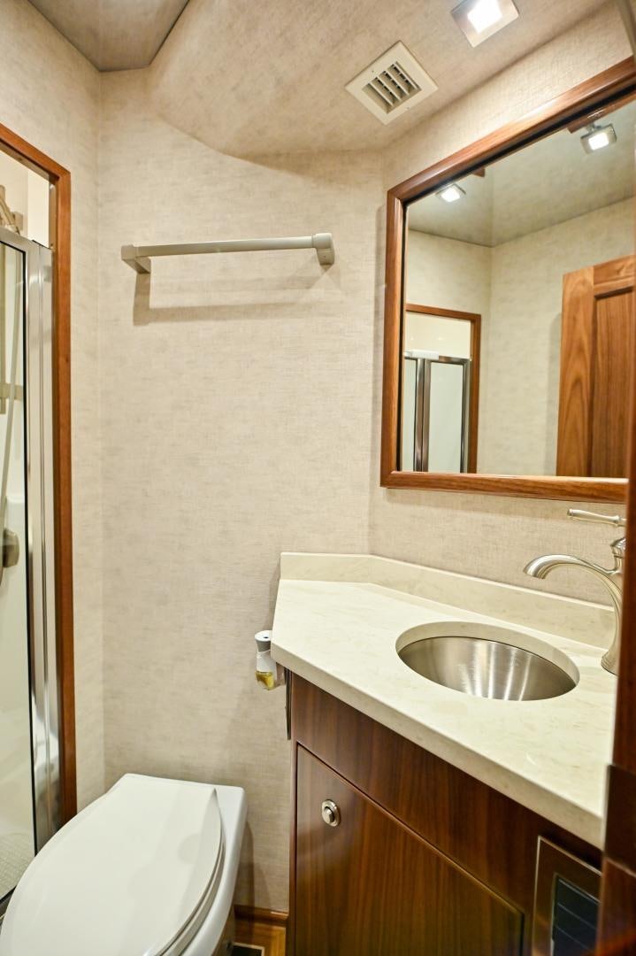 a bathroom with a sink and a toilet aboard EL LOBO Yacht for Sale
