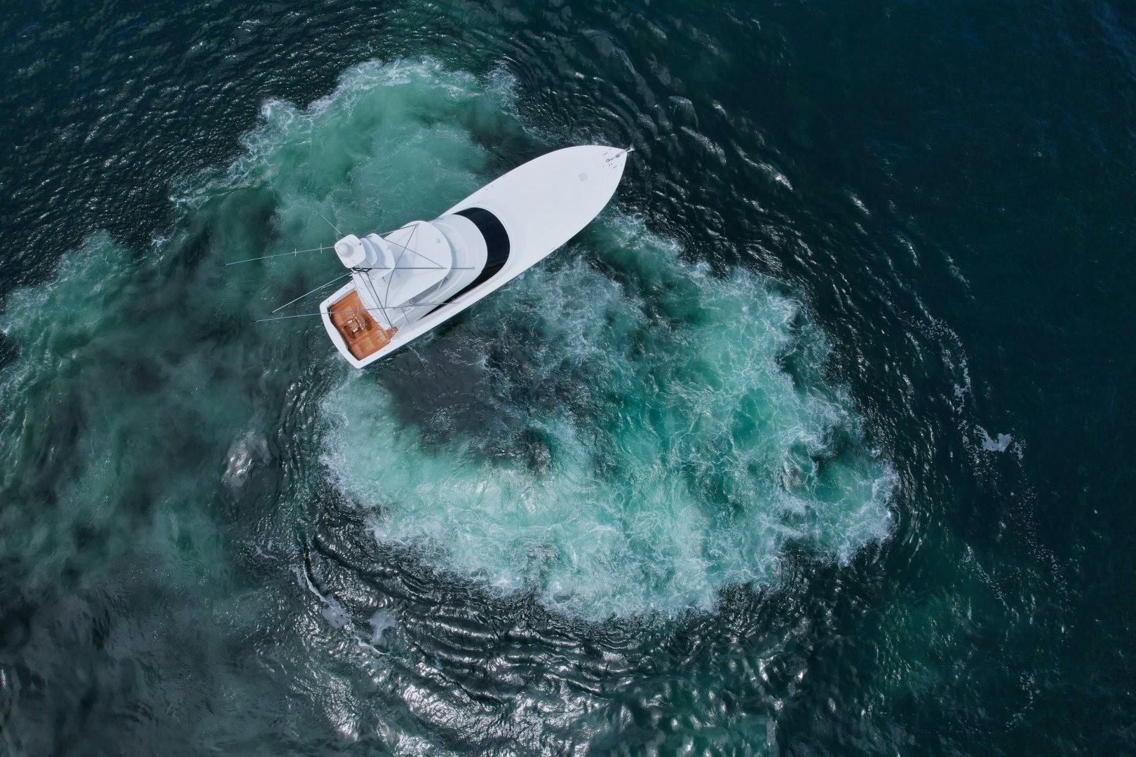 a person surfing on the waves aboard EL LOBO Yacht for Sale