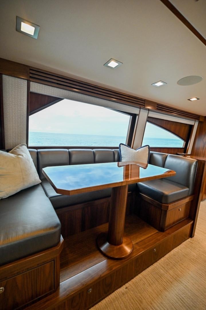 a room with a table and couches aboard EL LOBO Yacht for Sale