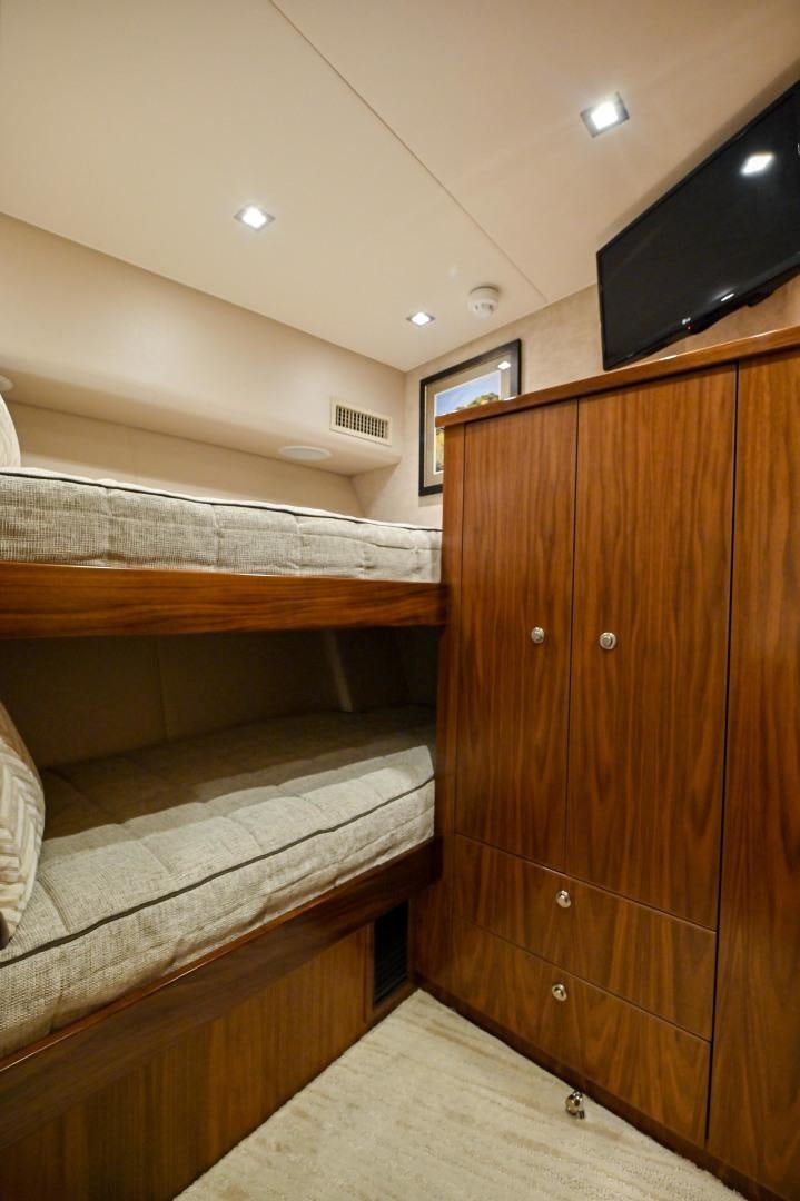 a room with wooden cabinets aboard EL LOBO Yacht for Sale