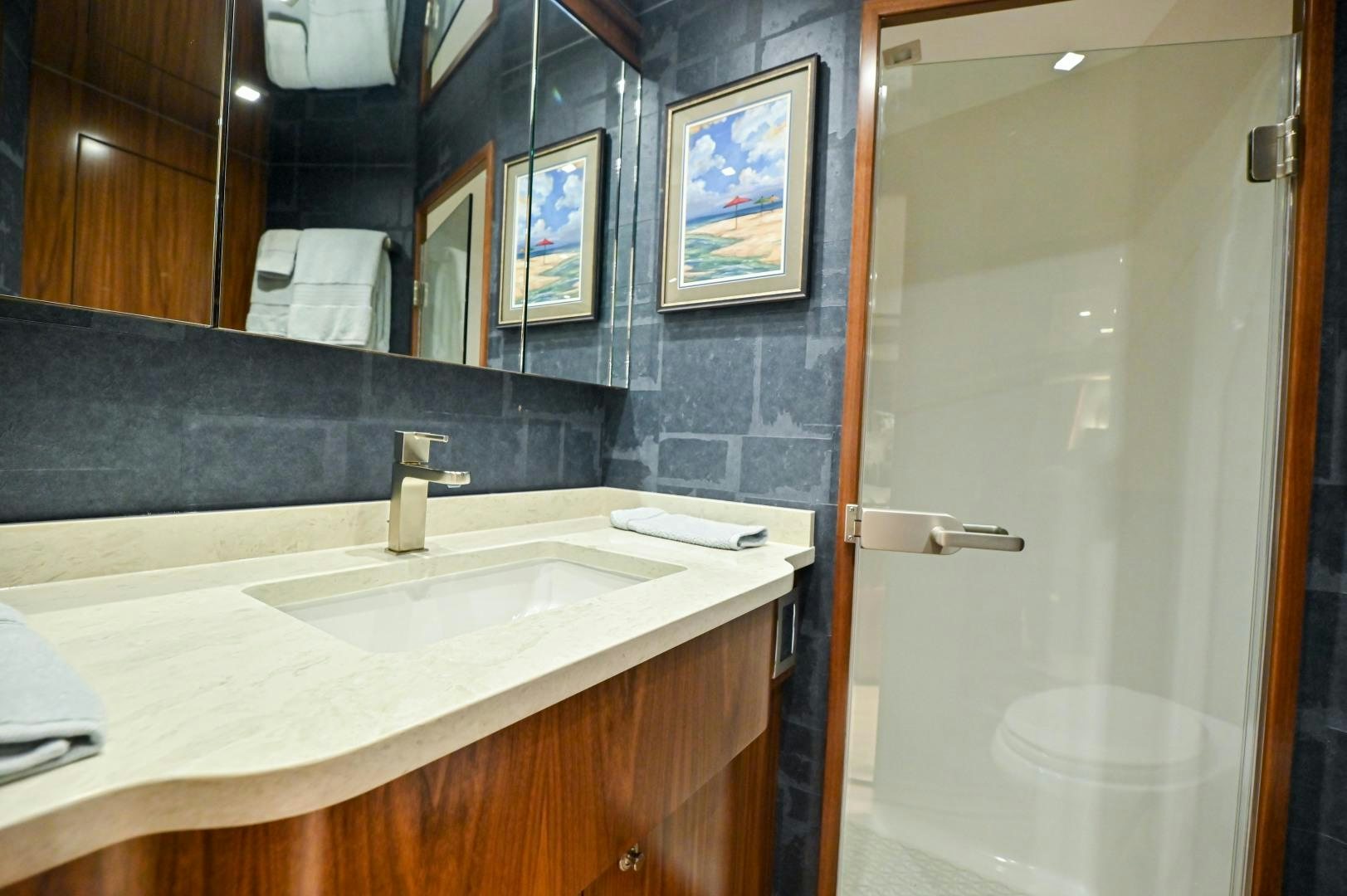 a bathroom with a sink and a shower aboard EL LOBO Yacht for Sale