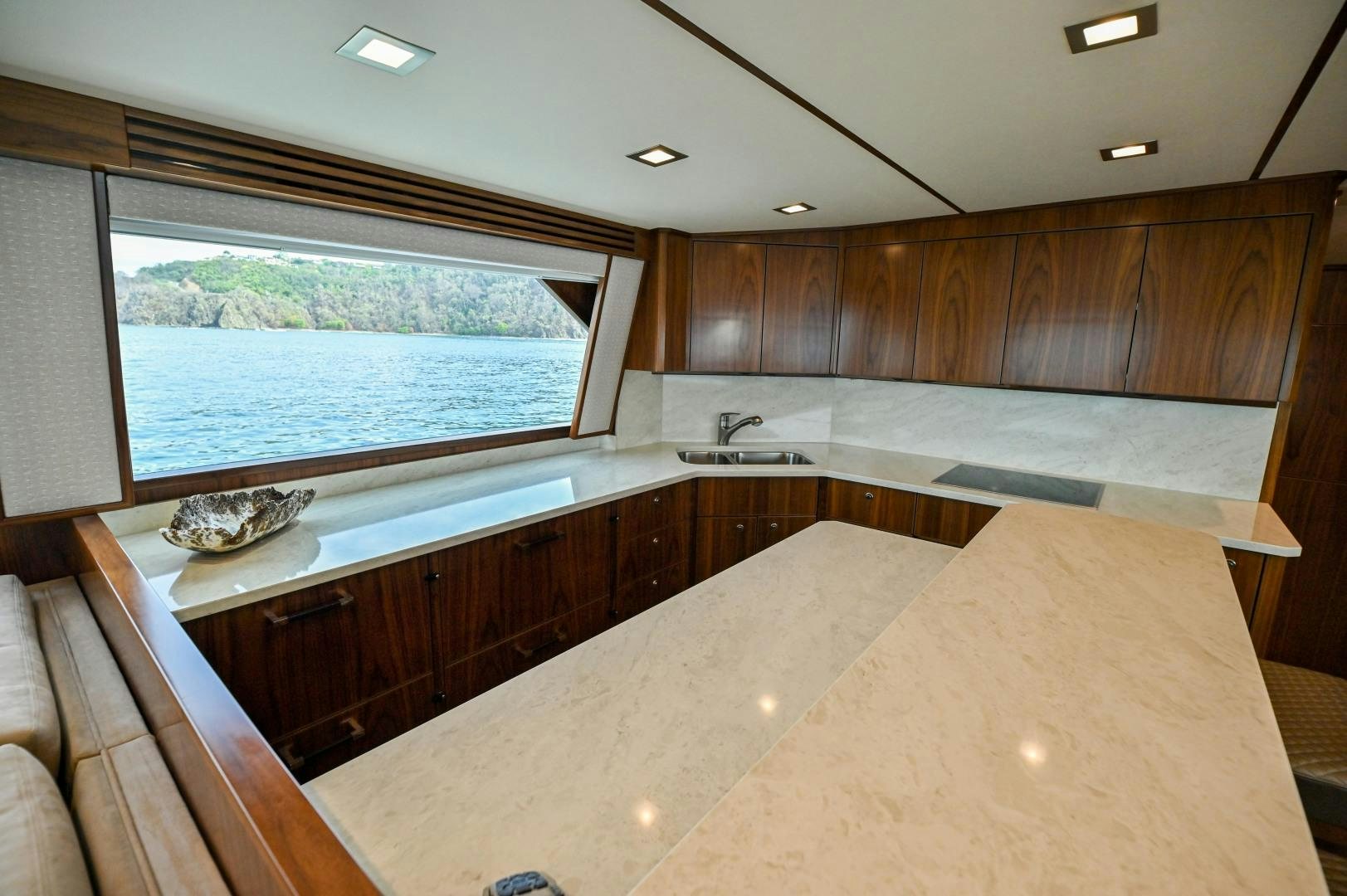 a large kitchen with a large window aboard EL LOBO Yacht for Sale