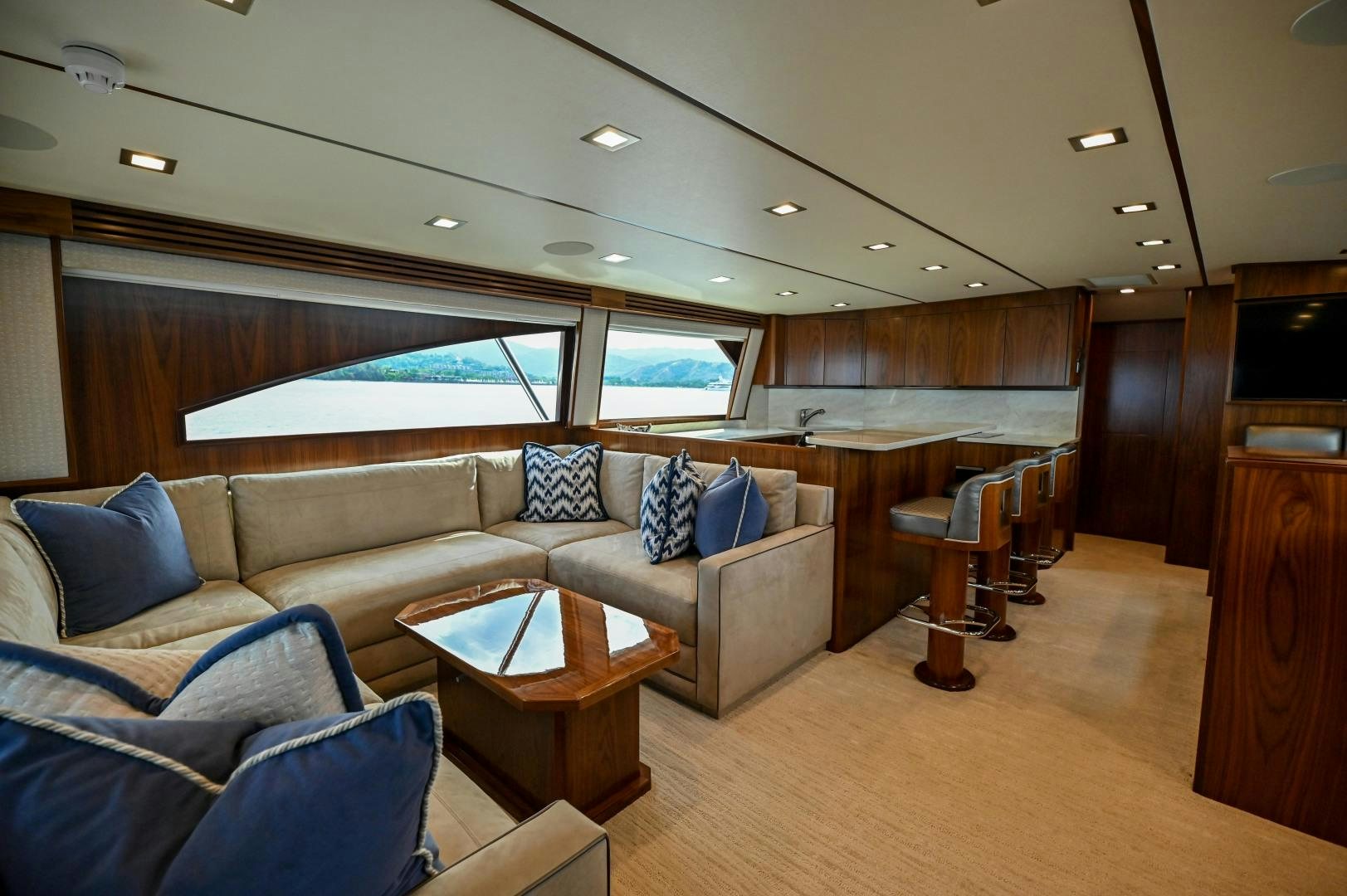 a living room with a couch and a table aboard EL LOBO Yacht for Sale
