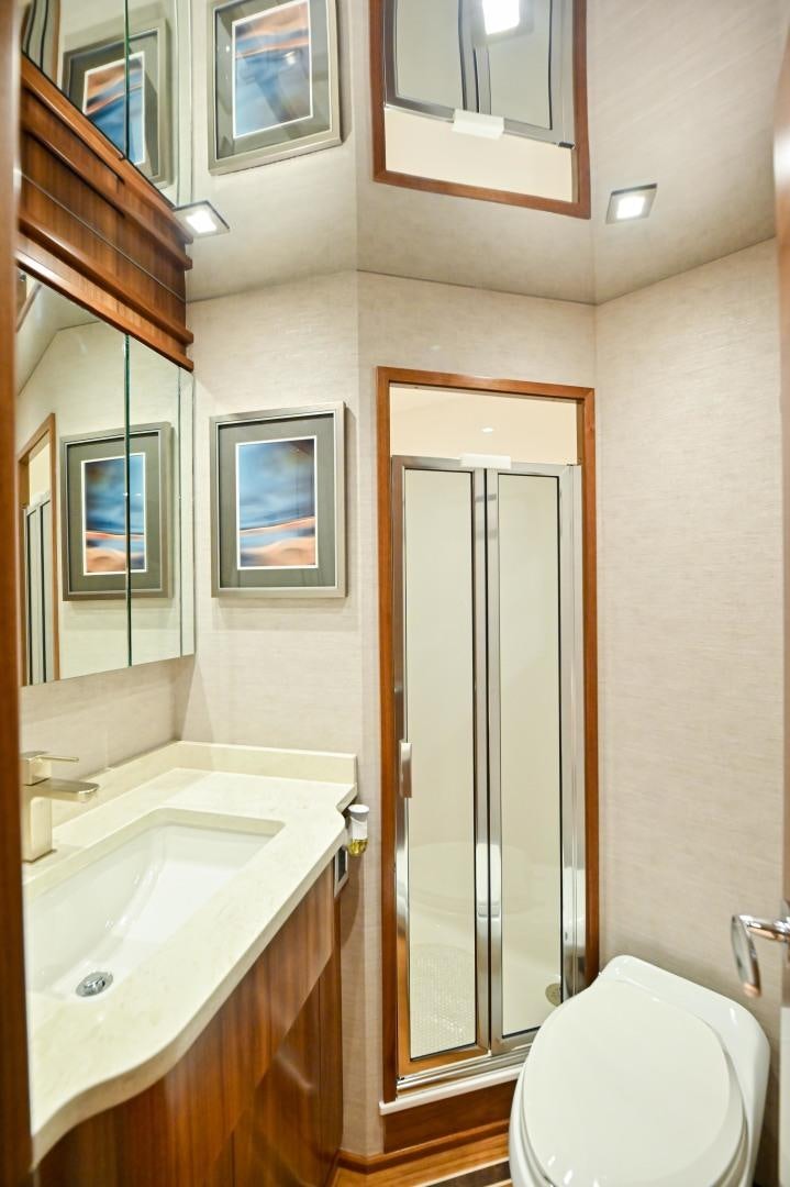 a bathroom with a sink and a toilet aboard EL LOBO Yacht for Sale