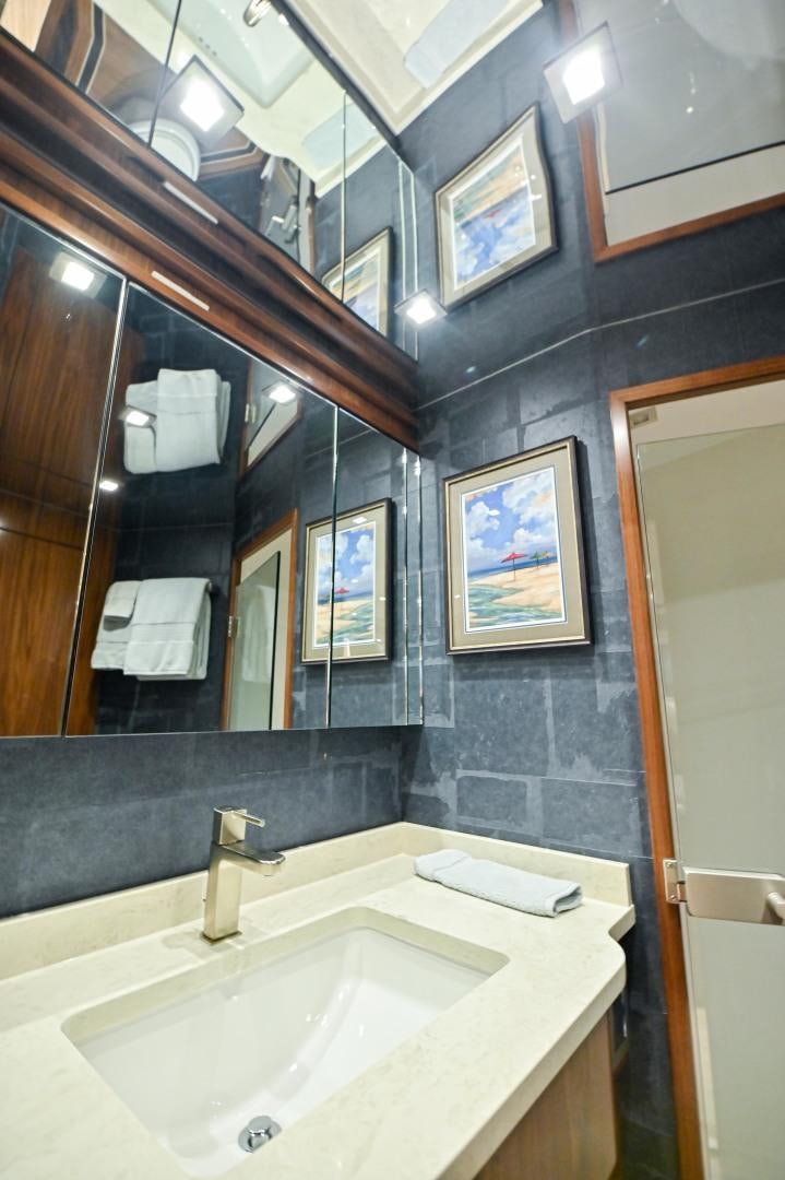 a bathroom with a large mirror aboard EL LOBO Yacht for Sale