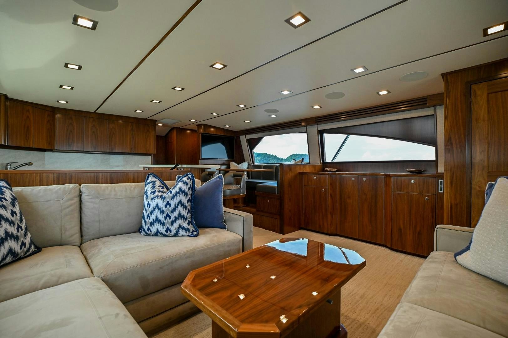 a living room with a couch and a table aboard EL LOBO Yacht for Sale