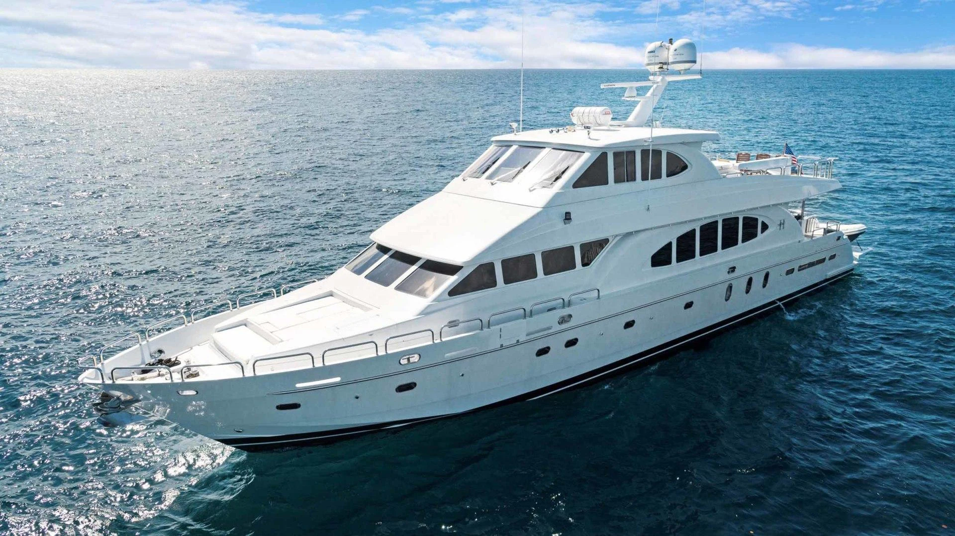 a white yacht in the ocean aboard B HAPPY Yacht for Sale