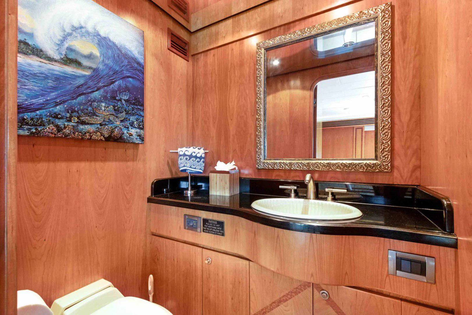 a bathroom with a large mirror aboard B HAPPY Yacht for Sale