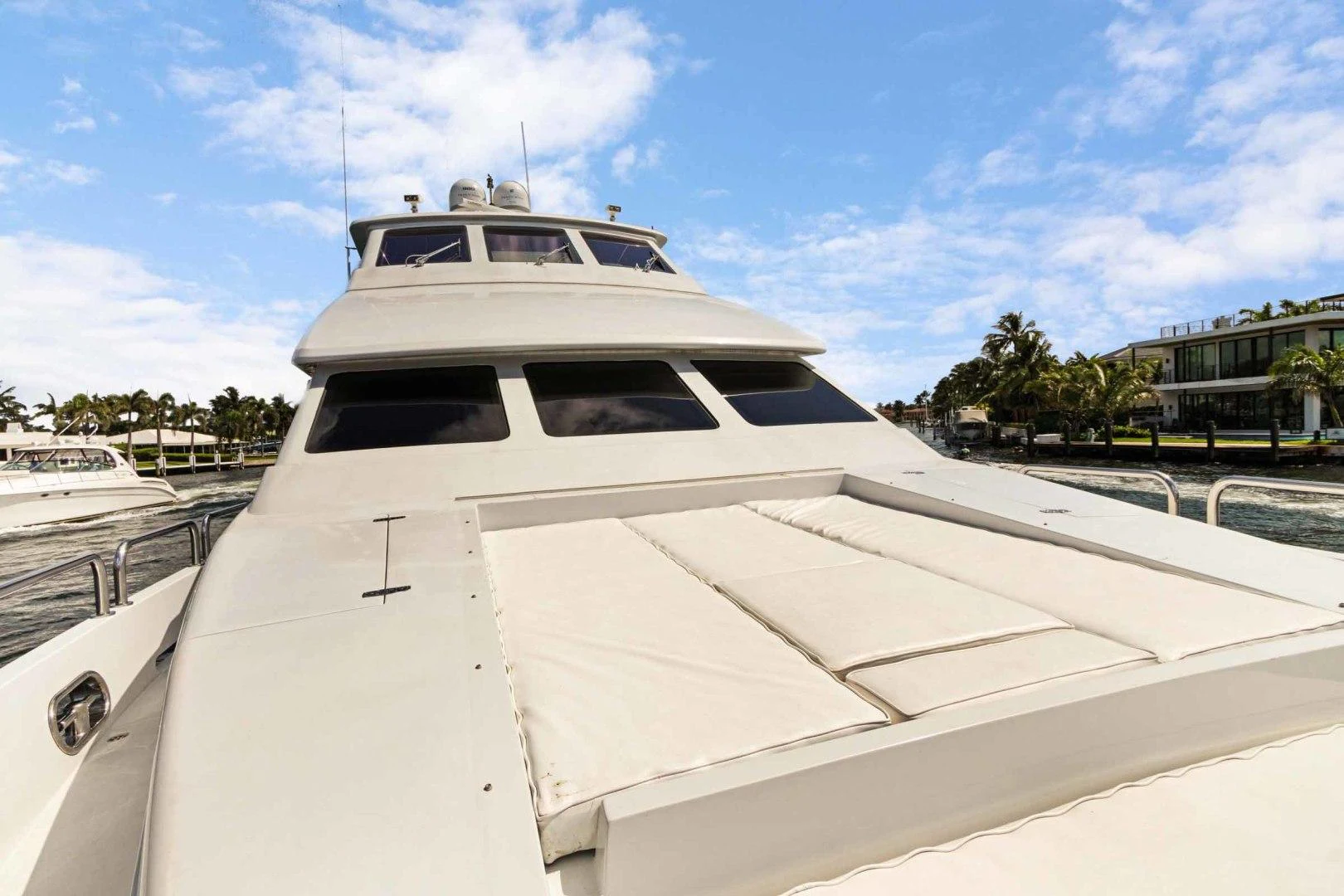 a white yacht on a dock aboard B HAPPY Yacht for Sale