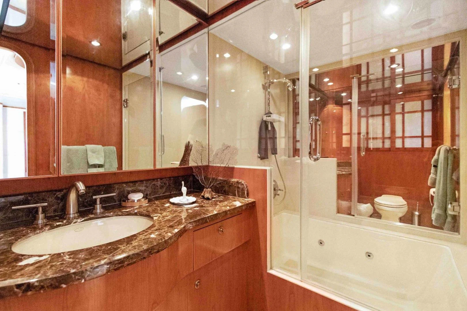 a bathroom with a large mirror aboard B HAPPY Yacht for Sale