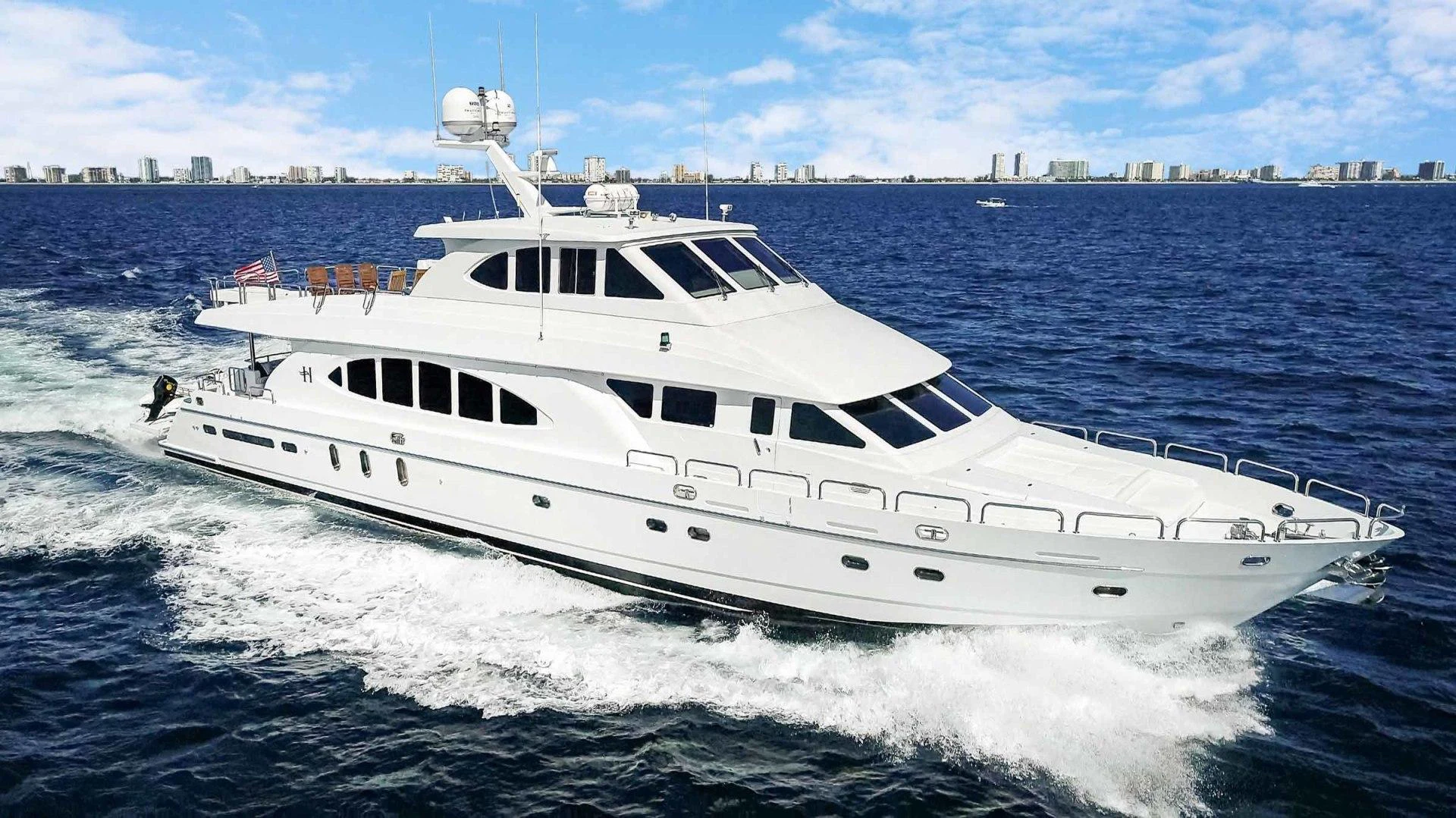a white yacht on the water aboard B HAPPY Yacht for Sale