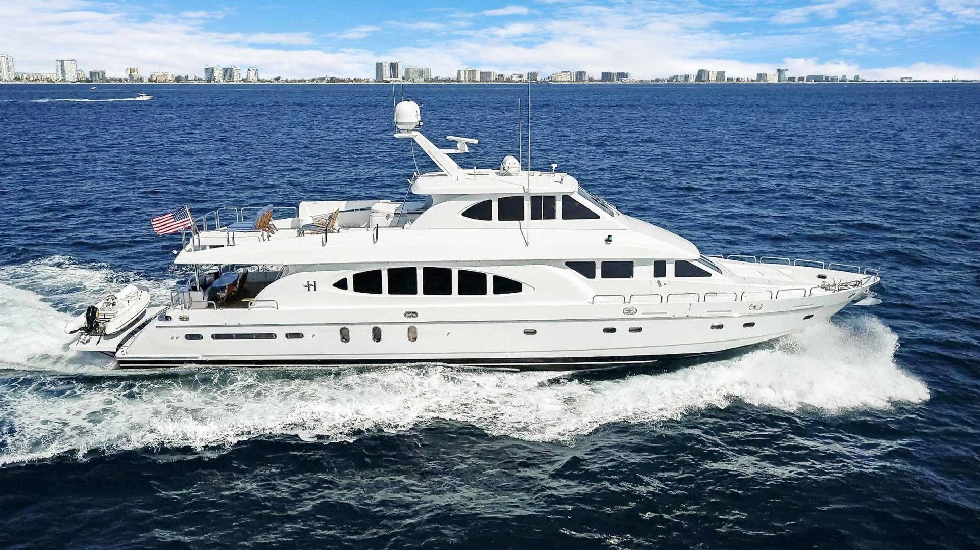 a white yacht on the water aboard B HAPPY Yacht for Sale