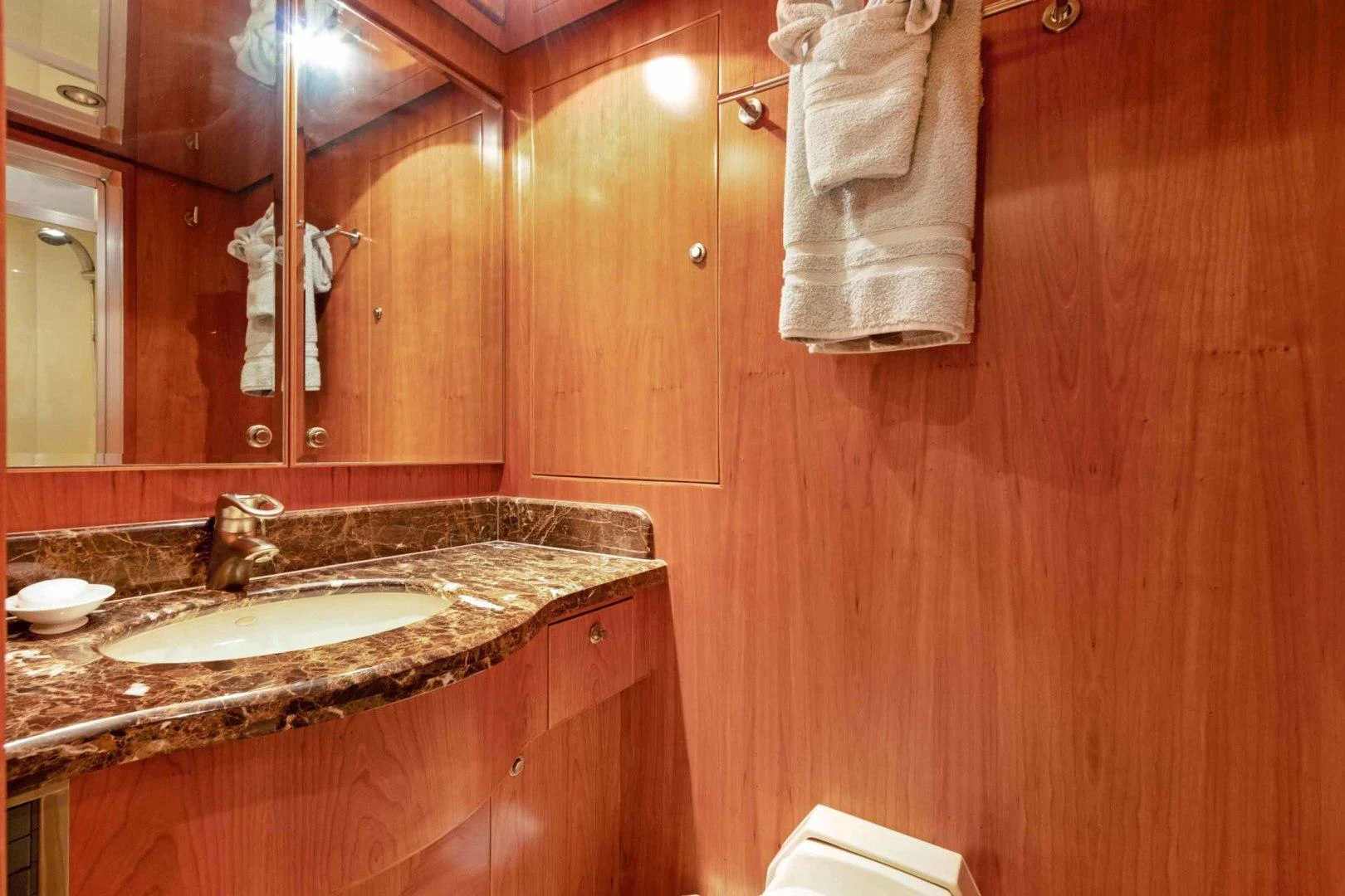 a bathroom with a sink and a mirror aboard B HAPPY Yacht for Sale