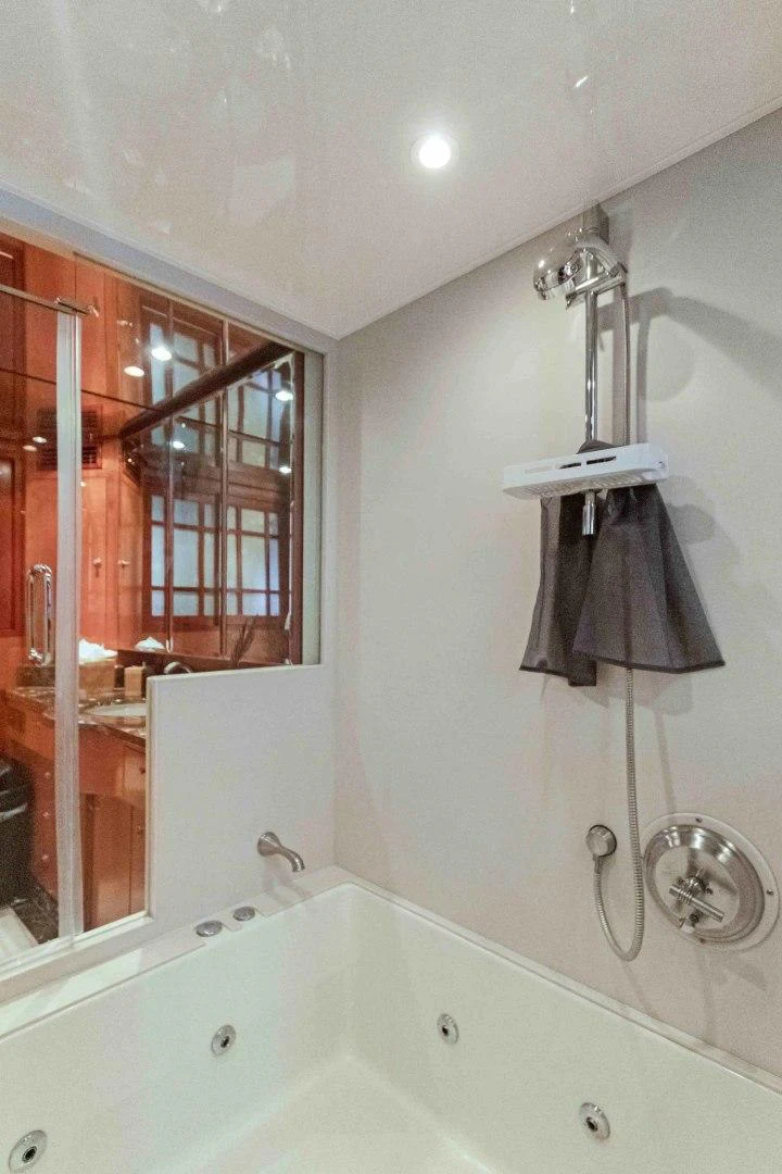 a bathroom with a bathtub and a sink aboard B HAPPY Yacht for Sale