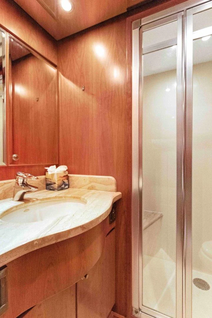 a bathroom with a shower and sink aboard B HAPPY Yacht for Sale