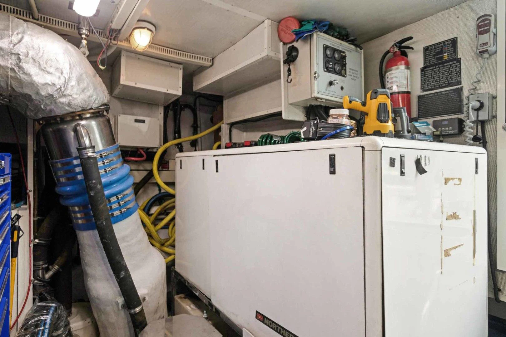 a white refrigerator with a blue object on top aboard B HAPPY Yacht for Sale