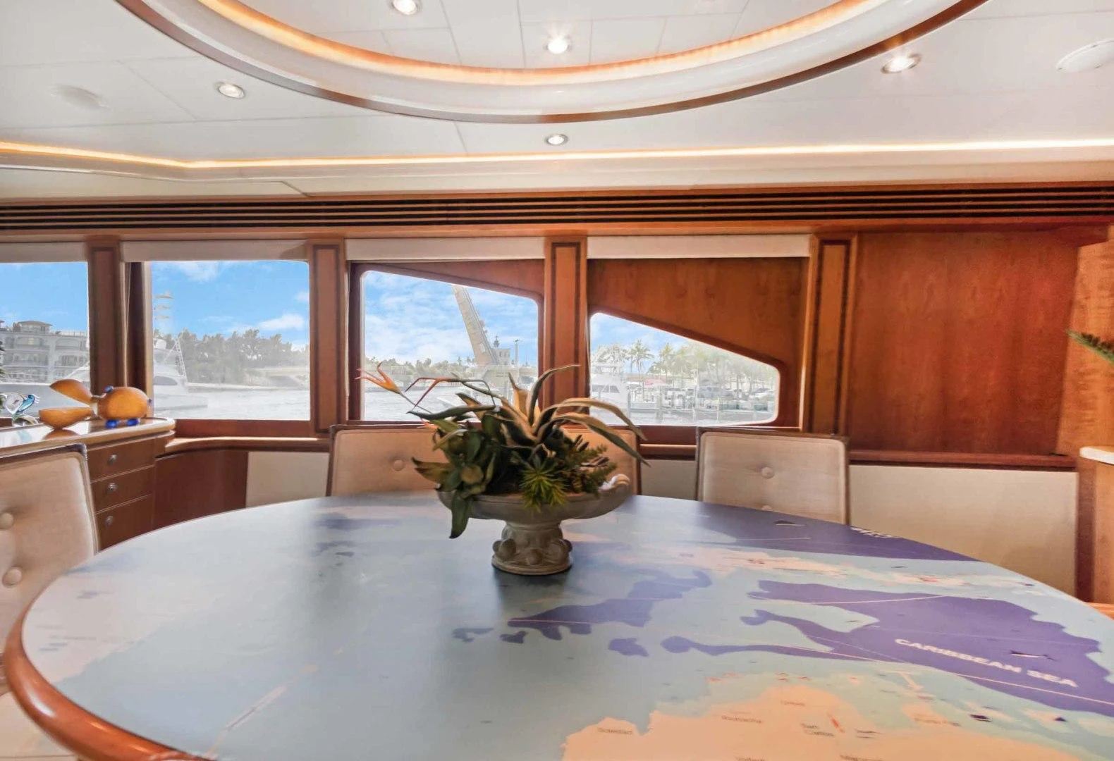 a room with a table and chairs aboard B HAPPY Yacht for Sale