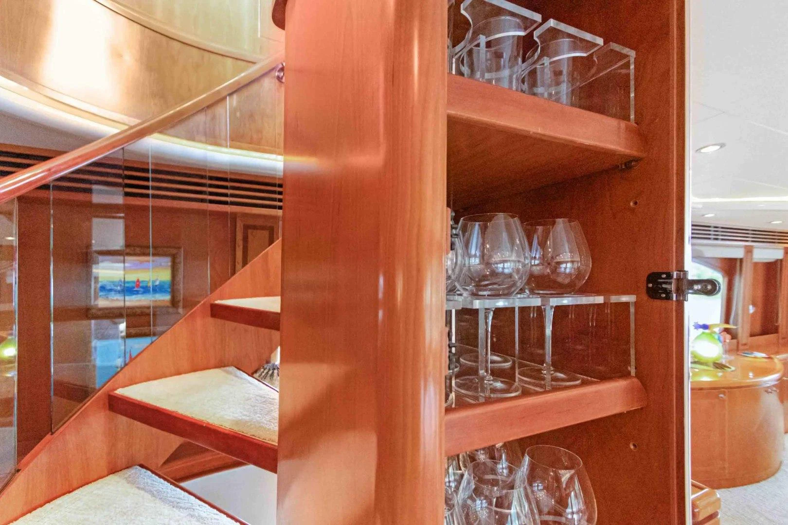 a wooden shelf with glasses and wine glasses aboard B HAPPY Yacht for Sale