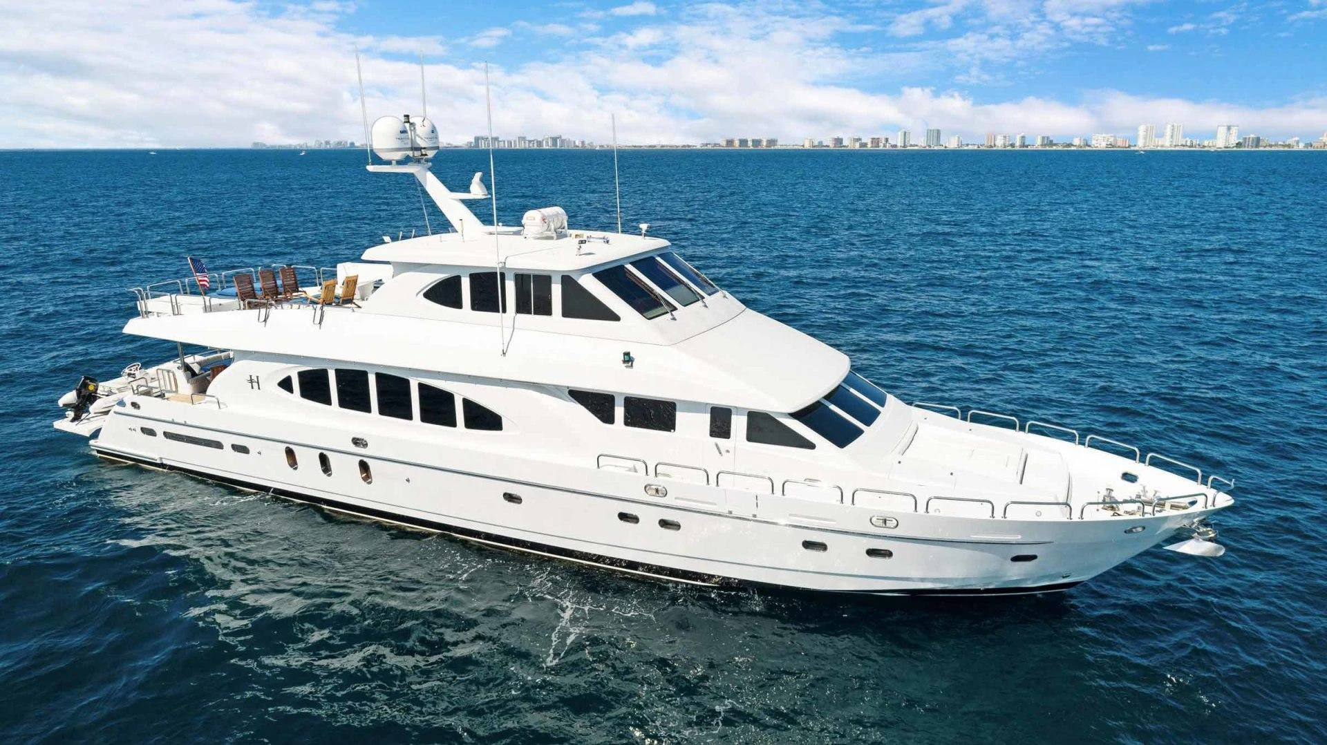 a white yacht in the water aboard B HAPPY Yacht for Sale