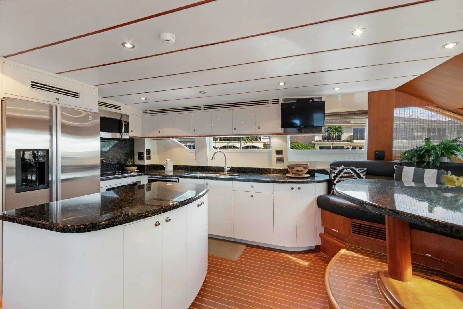 a kitchen with white cabinets aboard B HAPPY Yacht for Sale