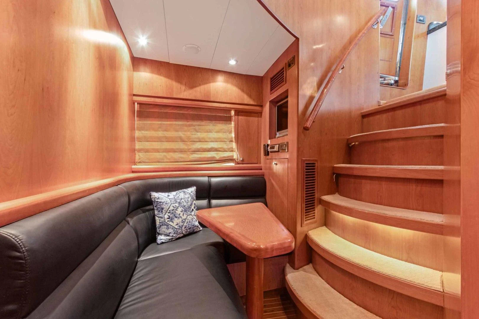 a couch and a table in a room aboard B HAPPY Yacht for Sale