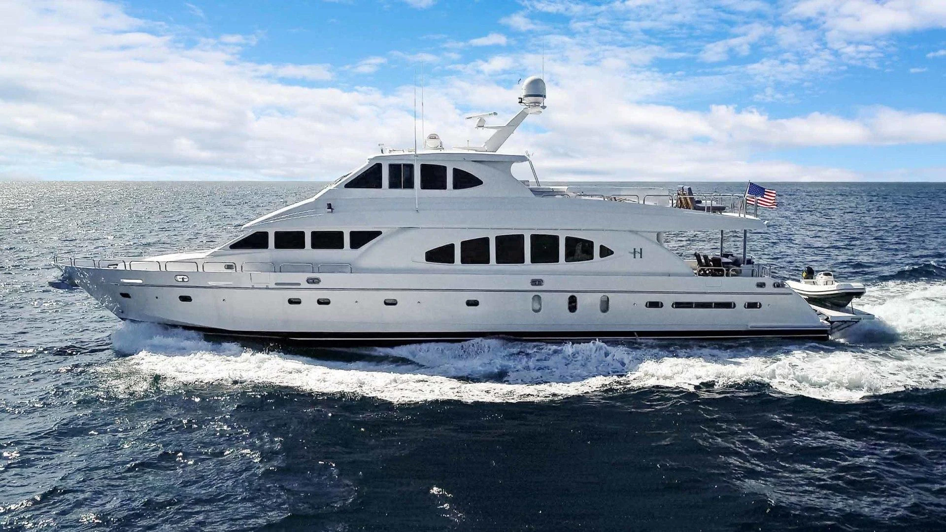 a white yacht on the water aboard B HAPPY Yacht for Sale