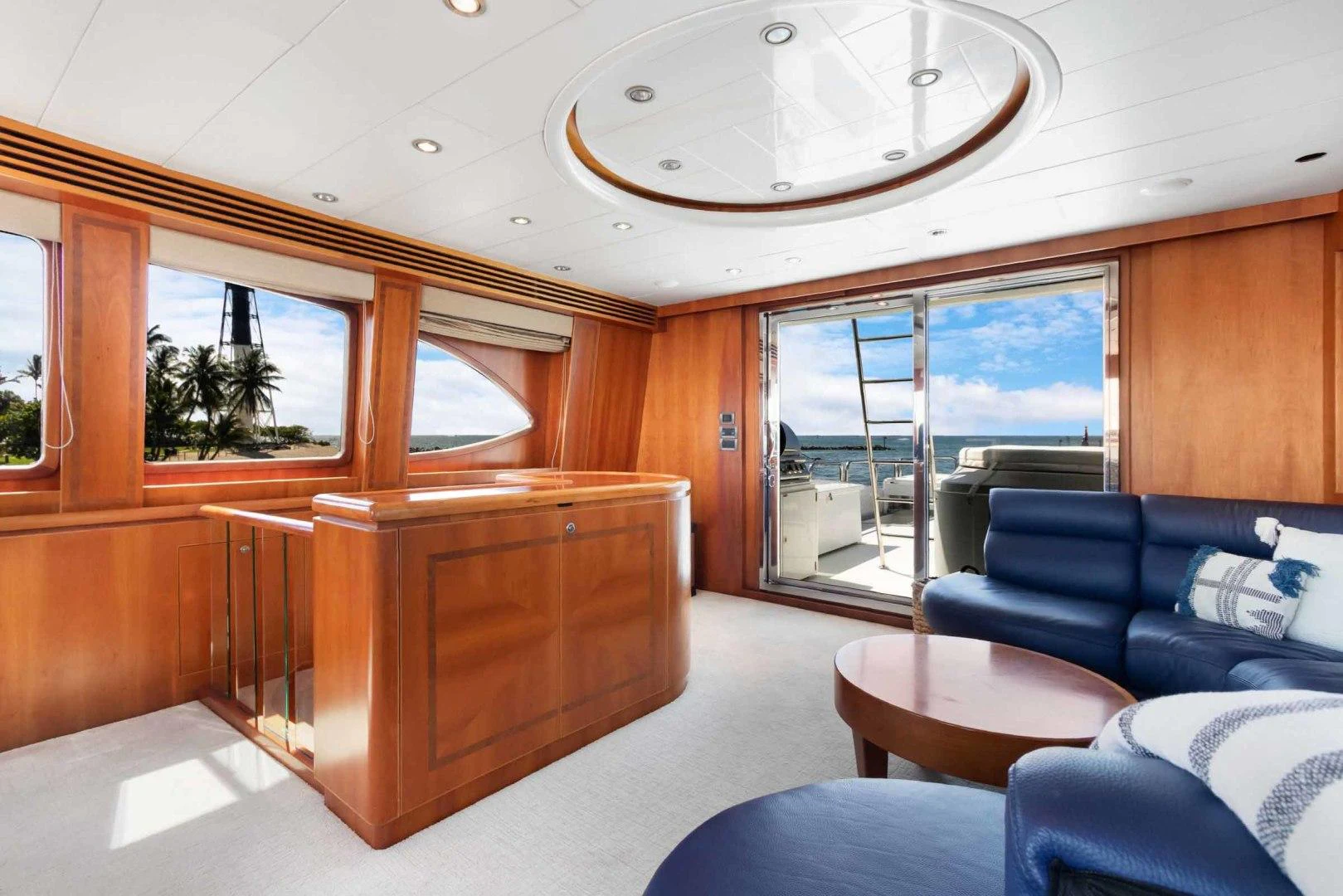 a room with a couch and a table and a large window aboard B HAPPY Yacht for Sale