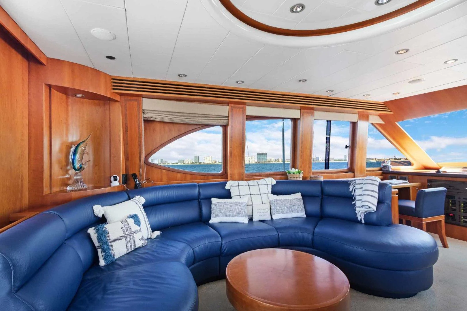 a living room with a blue couch aboard B HAPPY Yacht for Sale