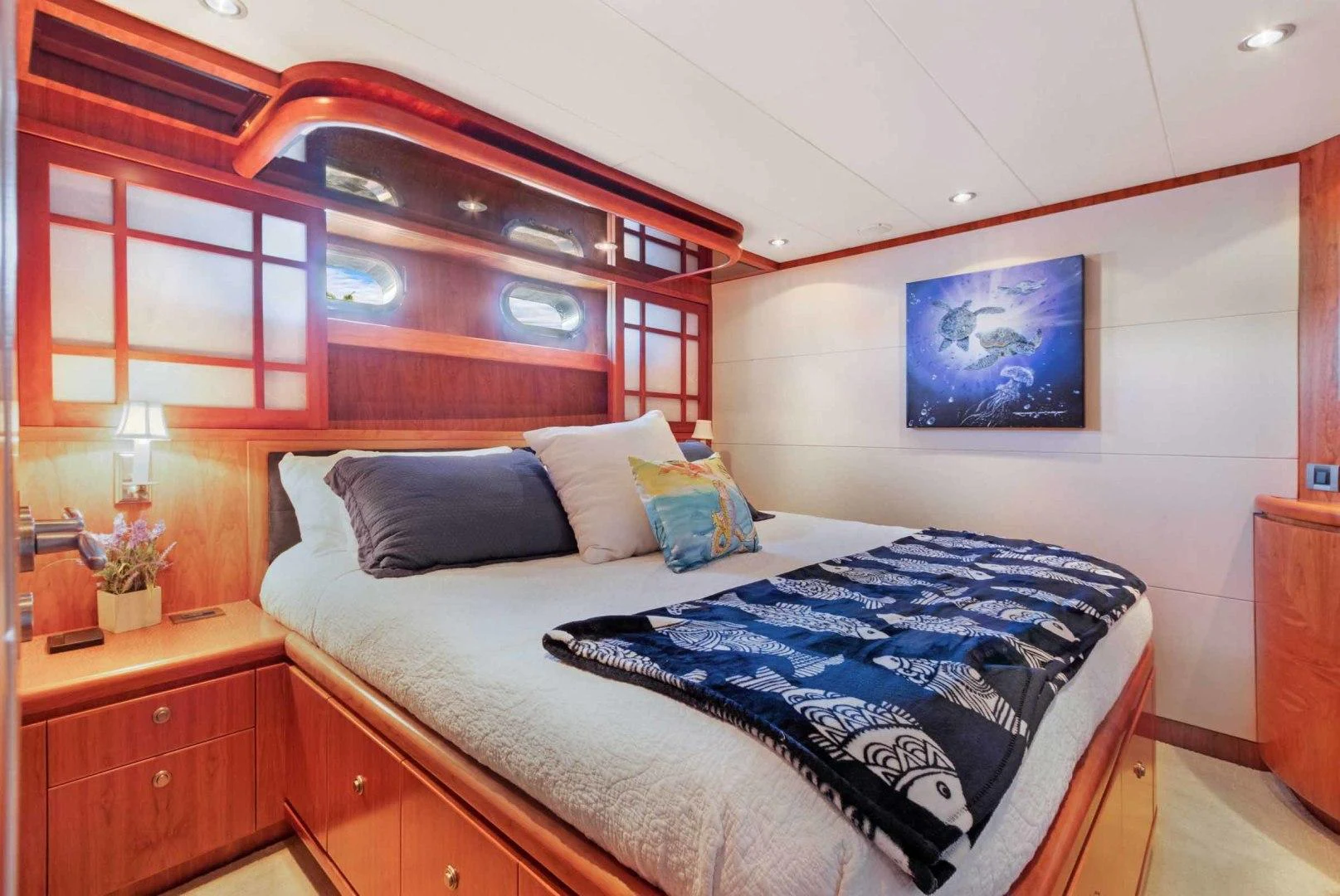 a bed with blue sheets aboard B HAPPY Yacht for Sale