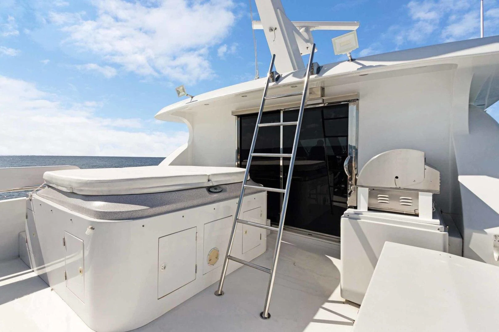 a ladder next to a white container aboard B HAPPY Yacht for Sale