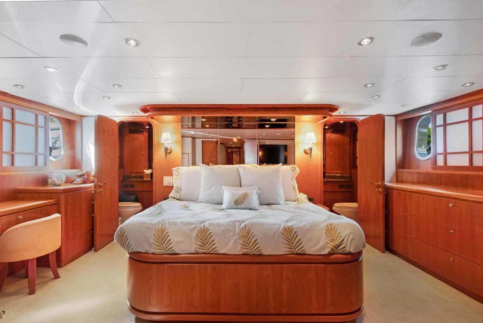 a room with a bed and desk aboard B HAPPY Yacht for Sale