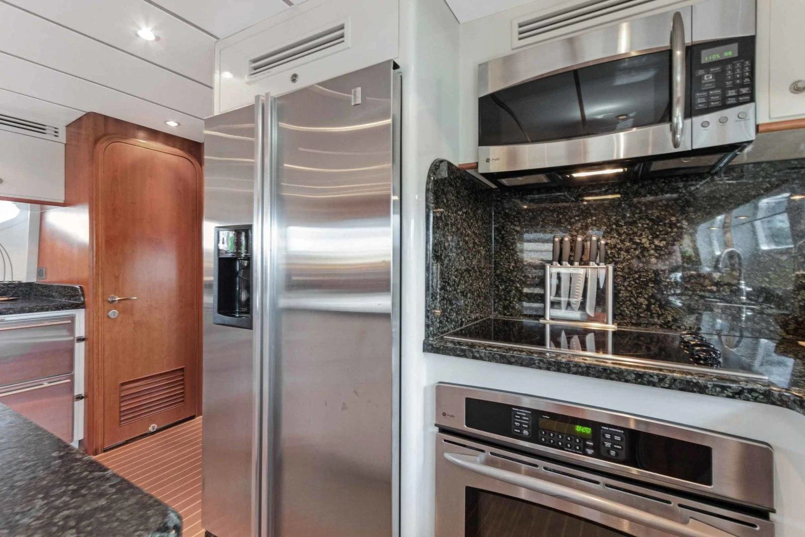 a kitchen with a microwave oven and a stove aboard B HAPPY Yacht for Sale