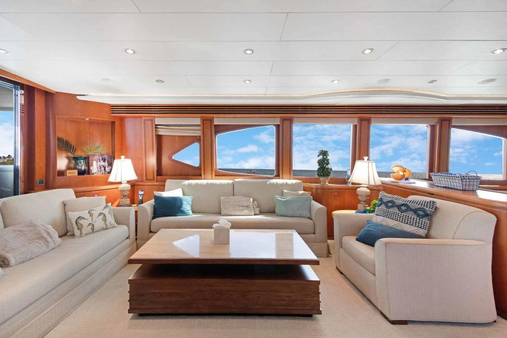 a living room with a couch and a table aboard B HAPPY Yacht for Sale