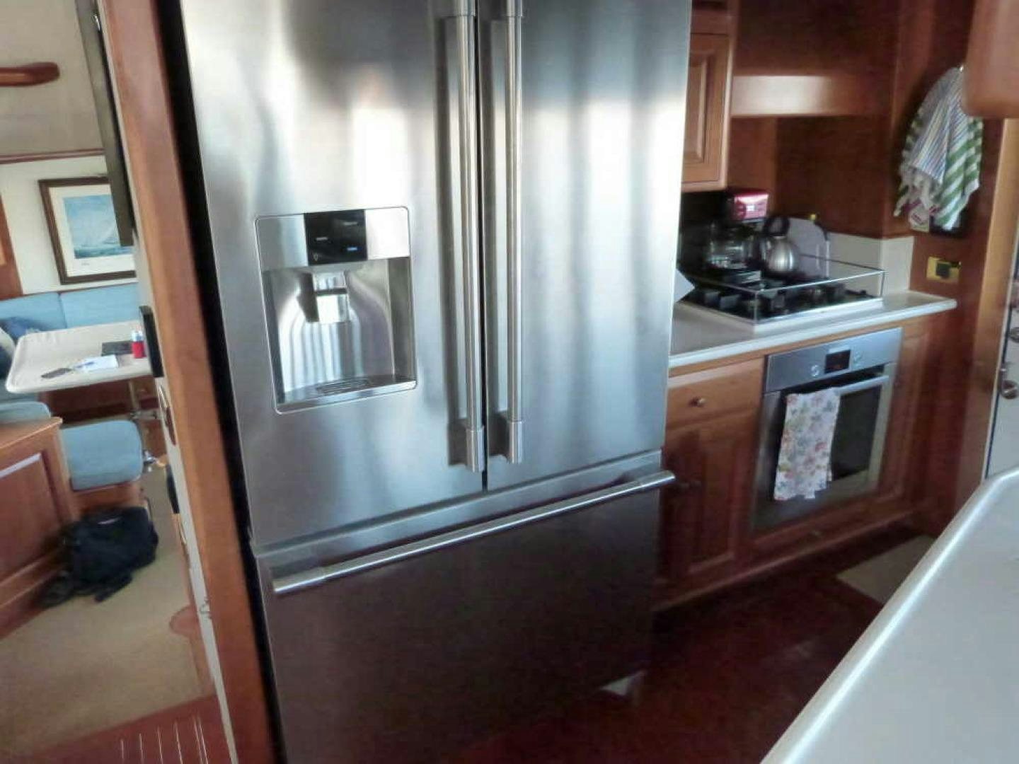 a stainless steel refrigerator in a kitchen aboard RANGELEY Yacht for Sale