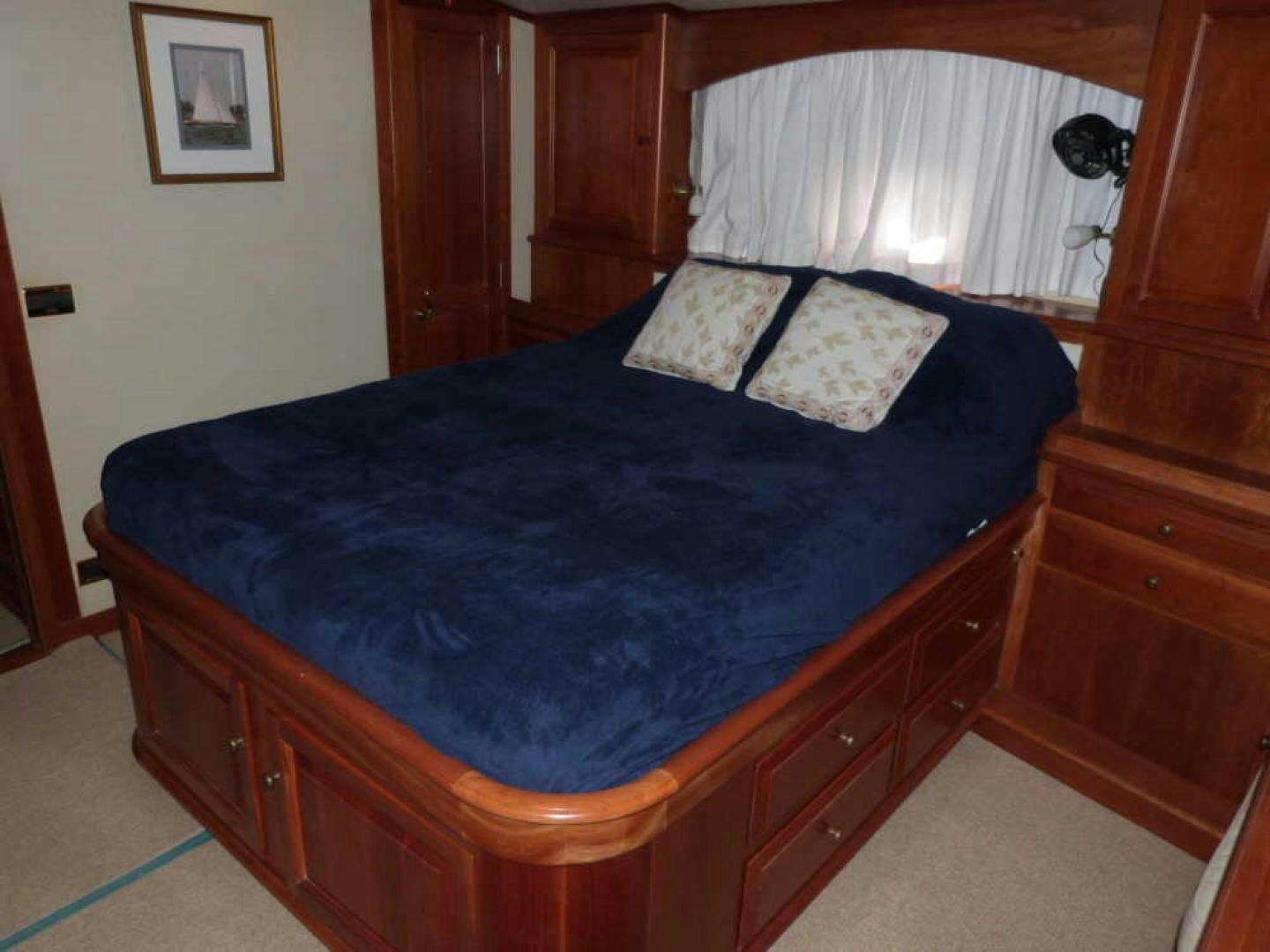 a bed with blue sheets aboard RANGELEY Yacht for Sale