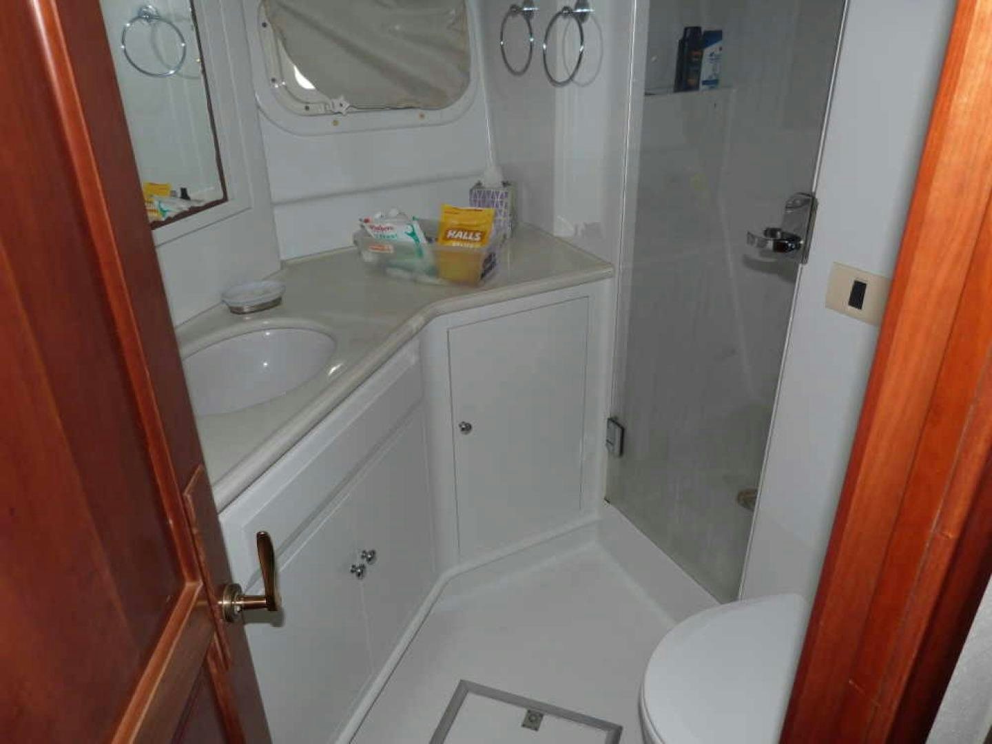a bathroom with a sink and a toilet aboard RANGELEY Yacht for Sale