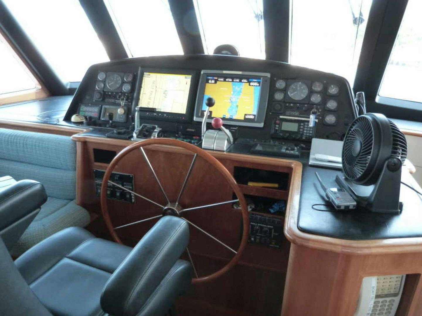 a desk with a computer and other electronics on it aboard RANGELEY Yacht for Sale