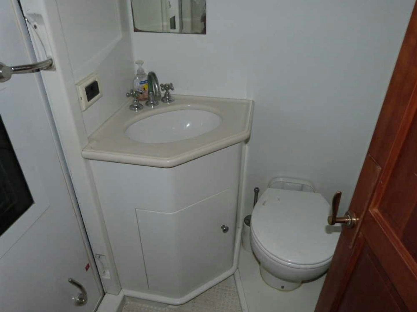 a small bathroom with a toilet aboard RANGELEY Yacht for Sale