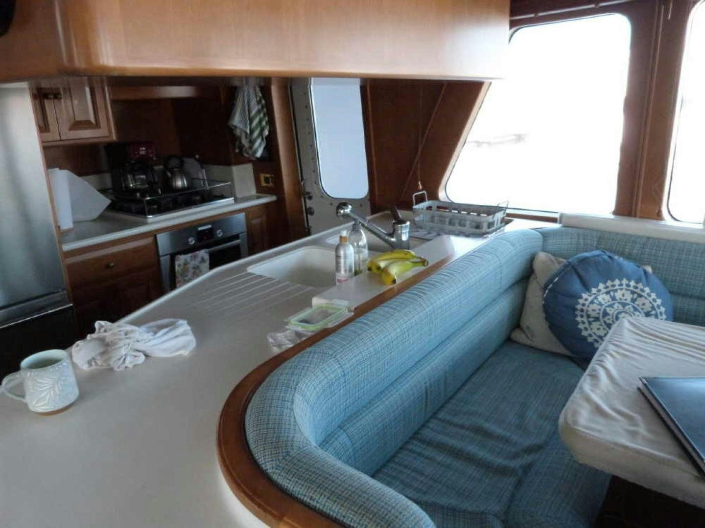 a kitchen with a blue couch aboard RANGELEY Yacht for Sale