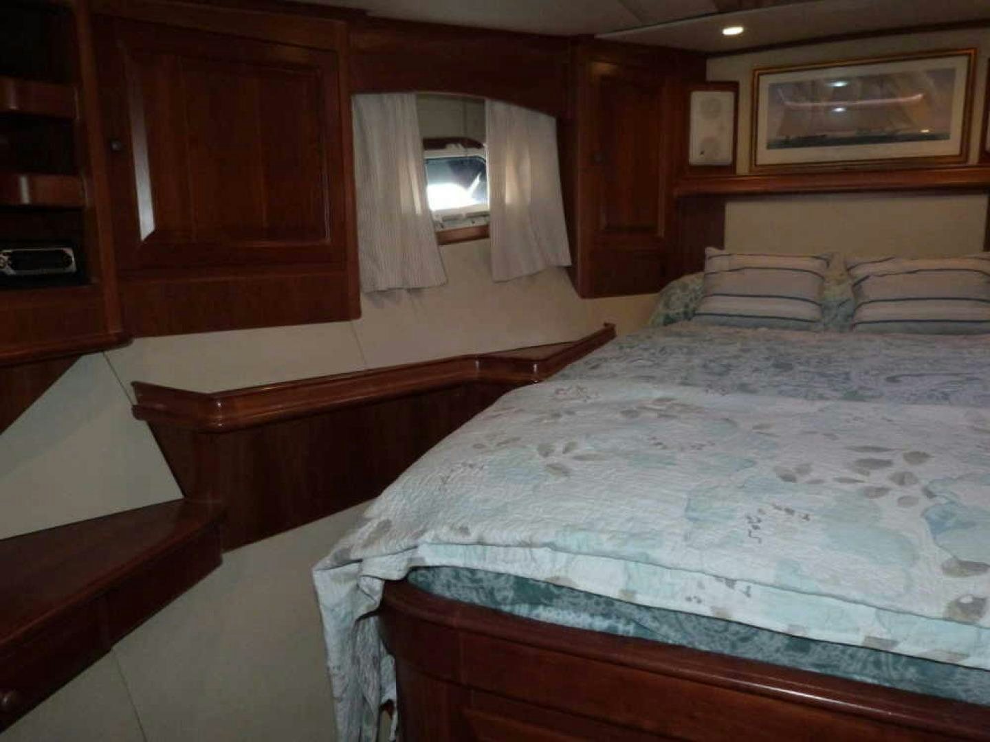 a bed with a white sheet aboard RANGELEY Yacht for Sale